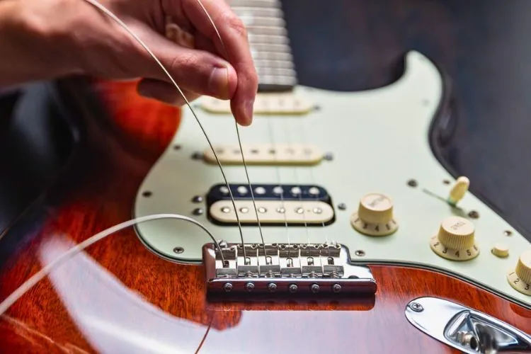 Electric Guitar Buzzing When Touching Strings